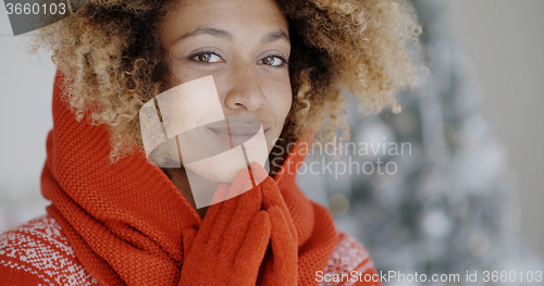 Image of Cute young African woman in winter fashion