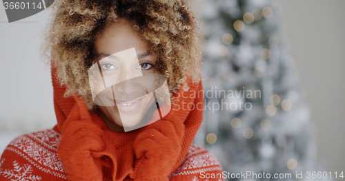 Image of Cute young African woman in winter fashion