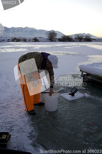 Image of Fisherman Icefishing