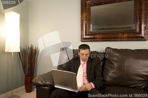 Image of Home or Office - Businessman Working on the Couch