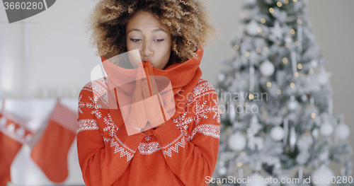 Image of Young African woman celebrating Christmas