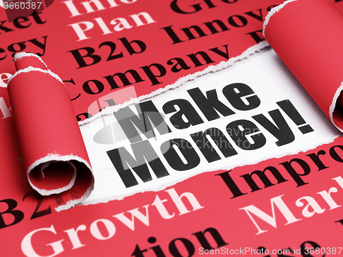 Image of Business concept: black text Make Money! under the piece of  torn paper