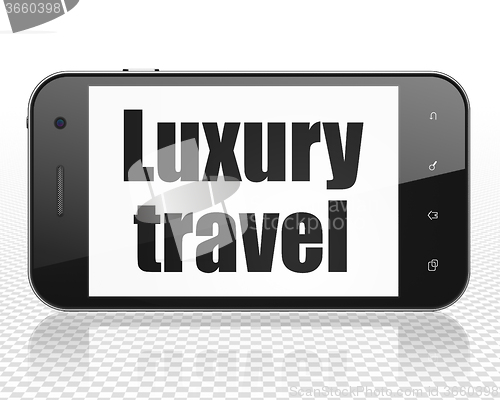 Image of Tourism concept: Smartphone with Luxury Travel on display