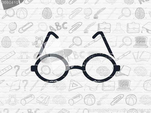Image of Studying concept: Glasses on wall background