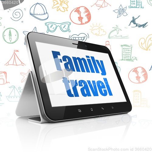 Image of Vacation concept: Tablet Computer with Family Travel on display