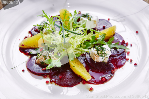 Image of salad of red beets and feta cheese with olive oil