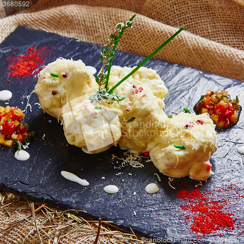 Image of cauliflower bites, vegetarian food.