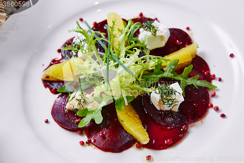 Image of salad of red beets and feta cheese with olive oil