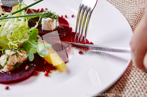 Image of salad of red beets and feta cheese with olive oil