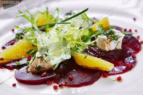 Image of salad of red beets and feta cheese with olive oil