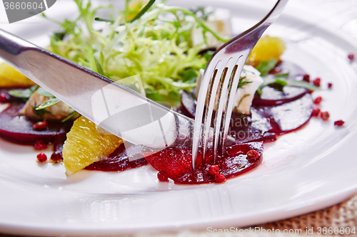 Image of salad of red beets and feta cheese with olive oil