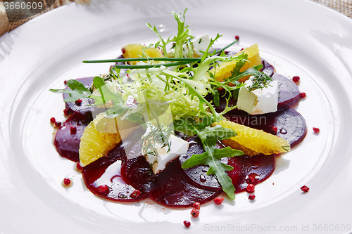 Image of salad of red beets and feta cheese with olive oil