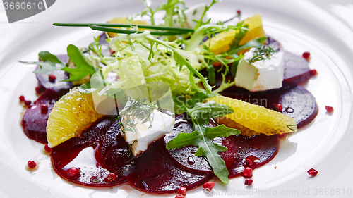 Image of salad of red beets and feta cheese with olive oil