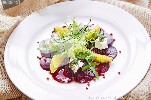 Image of salad of red beets and feta cheese with olive oil