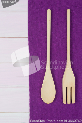 Image of Kitchenware on purple towel