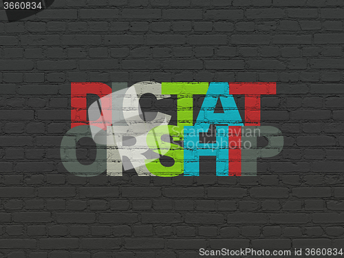 Image of Politics concept: Dictatorship on wall background