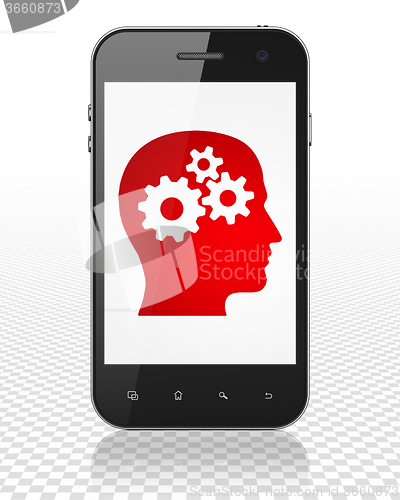 Image of Marketing concept: Smartphone with Head With Gears on display