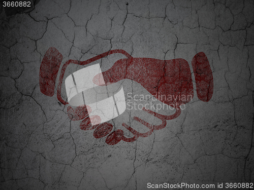 Image of Finance concept: Handshake on grunge wall background