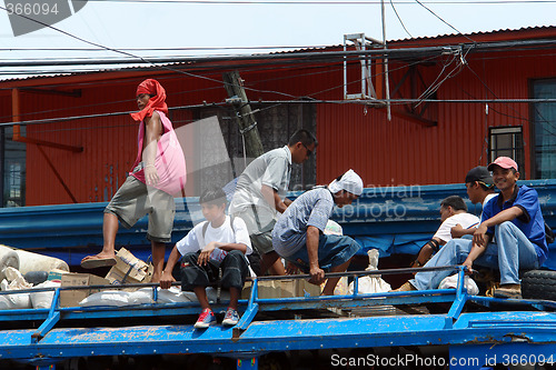 Image of Passengers on top of Philippine Jeepney.