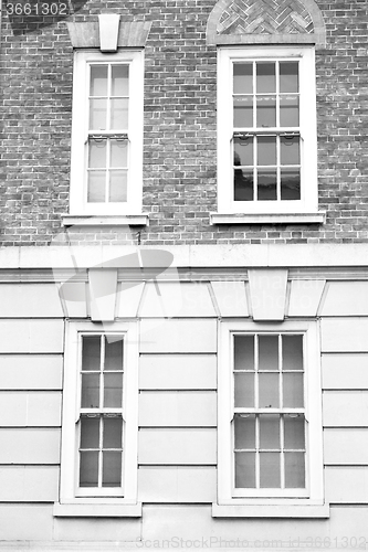 Image of old windon in england london brick and glass the wall 
