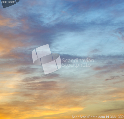 Image of the sunrise in  colored sky white soft clouds and abstract backg