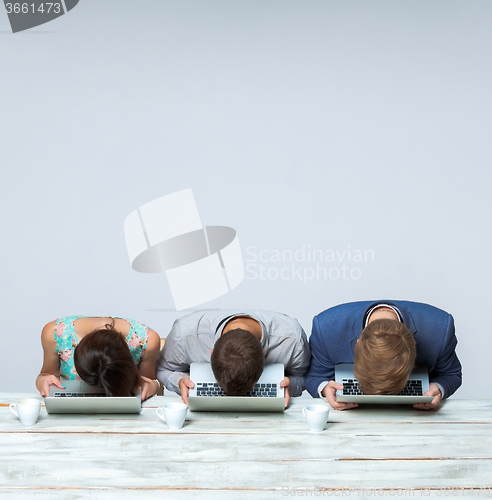 Image of Business team working together at office and sleeping on gray background