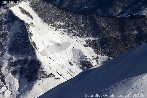 Image of View from off-piste slope on snowy canyon