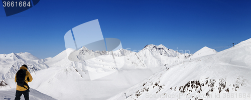 Image of Snowboarder and panoramic view on ski resort