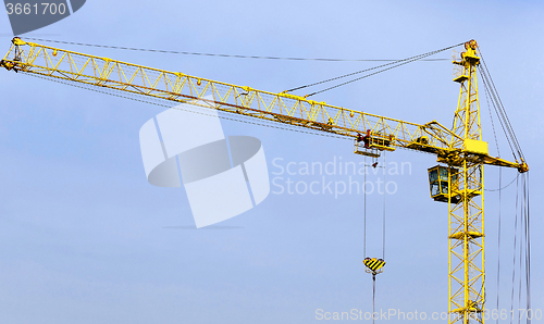 Image of Cranes  against the sky