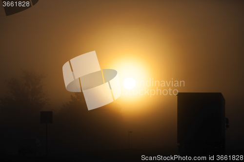 Image of foggy morning .  truck