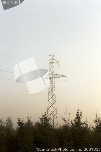 Image of power line . sunrise sun