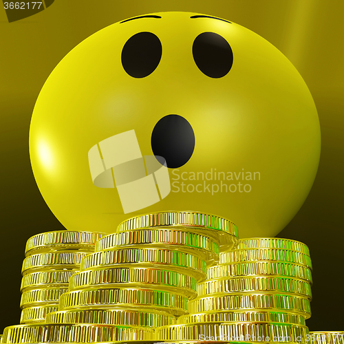 Image of Surprised Smiley With Coins Showing Sudden Success