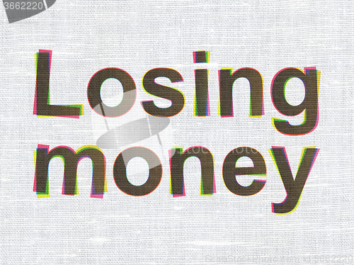 Image of Money concept: Losing Money on fabric texture background