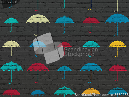 Image of Privacy concept: Umbrella icons on wall background