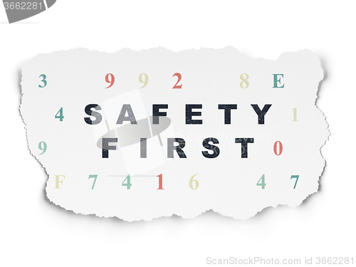 Image of Protection concept: Safety First on Torn Paper background