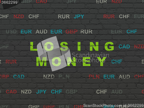 Image of Money concept: Losing Money on wall background