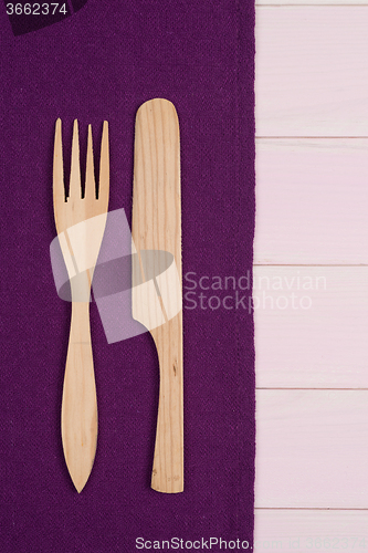 Image of Kitchenware on purple towel