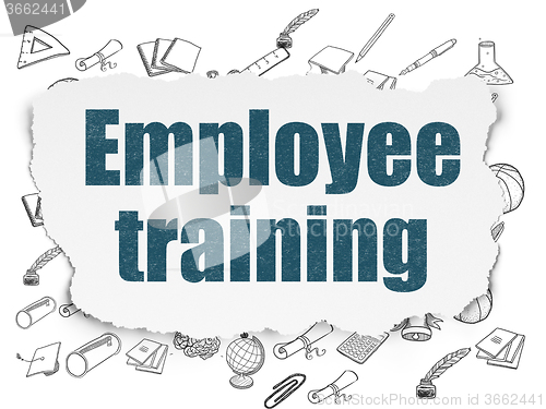 Image of Learning concept: Employee Training on Torn Paper background