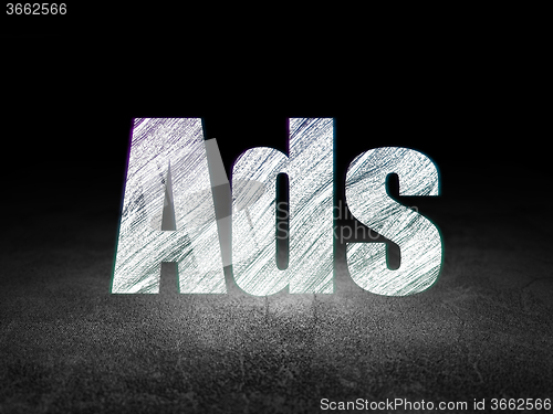 Image of Marketing concept: Ads in grunge dark room