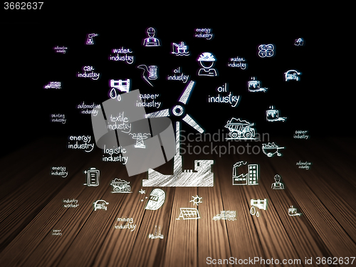 Image of Manufacuring concept: Windmill in grunge dark room