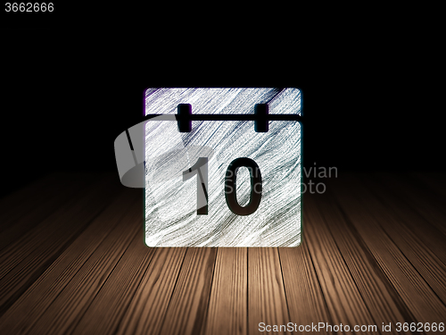 Image of Time concept: Calendar in grunge dark room