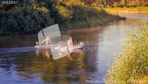 Image of Fishermen on the river float boat