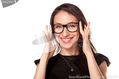 Image of Happy woman with a new glasses at optics