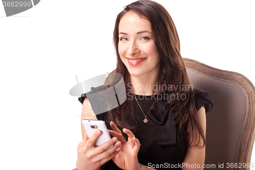 Image of Woman is text messaging using smartphone