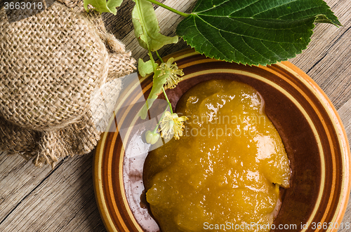 Image of Saucer with lime honey on the table