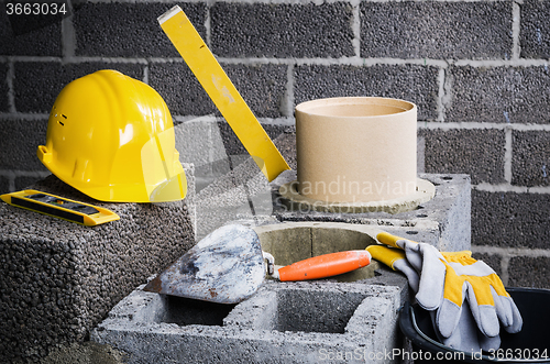 Image of Construction of modular ceramic chimney in the house