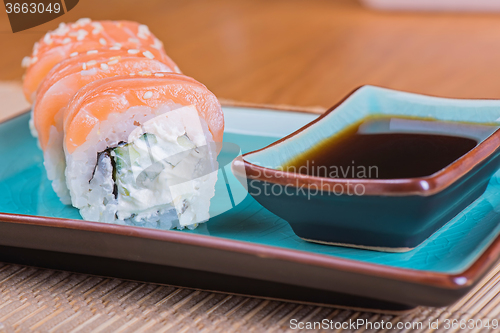 Image of California maki sushi with fish 