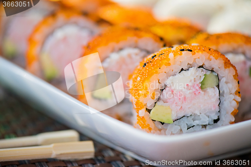 Image of California maki sushi with orange masago