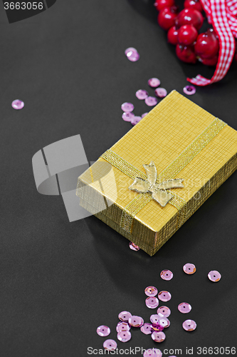 Image of Christmas gift box, pink sequins and decoration