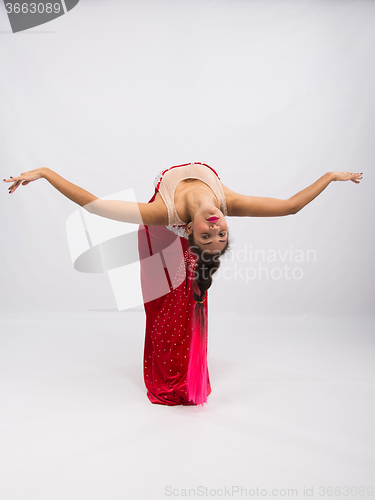 Image of Girl dancer performs a dance elements